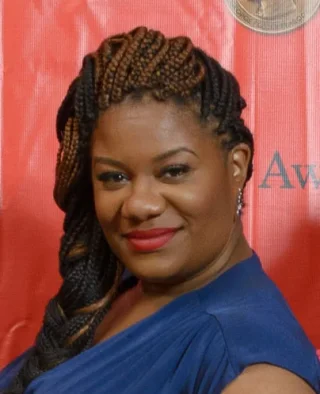Adrienne C. Moore height profile photo