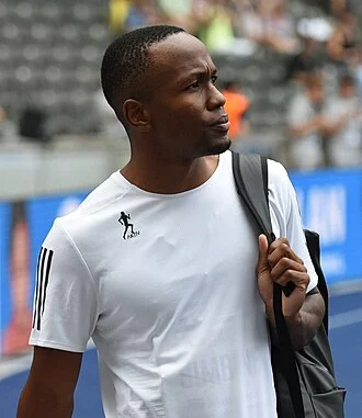 Akani Simbine height profile photo