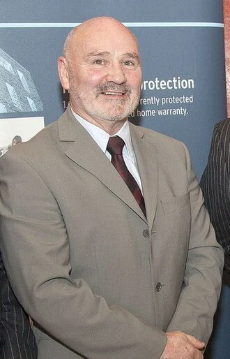 Alex Maskey height profile photo