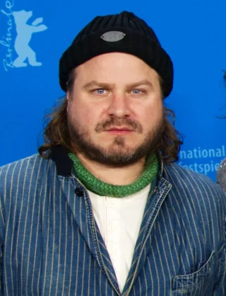 Brady Corbet height profile photo
