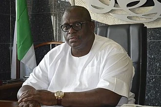 Buruji Kashamu height profile photo