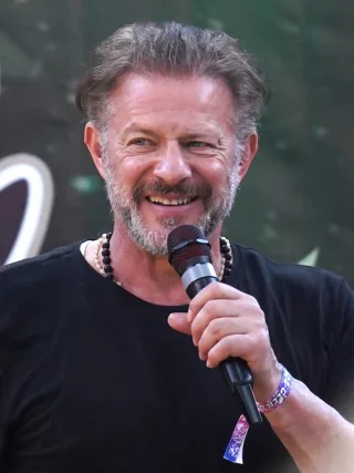 Costas Mandylor height profile photo