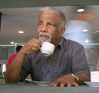 E. C. George Sudarshan height profile photo