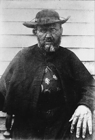 Father Damien height profile photo