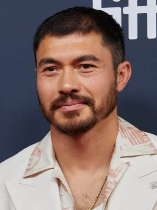 Henry Golding height profile photo