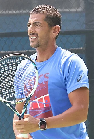 Issam Jellali height profile photo