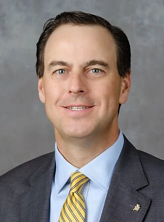 John Currie (athletic director) height profile photo