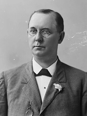 John H. Mitchell height profile photo