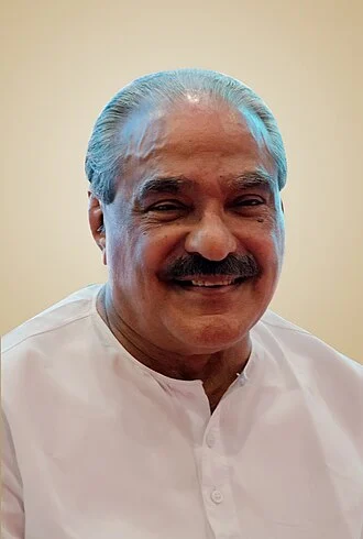 K. M. Mani height profile photo