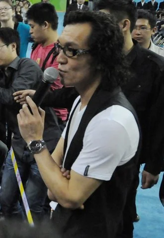 Li Yong (television host) height profile photo