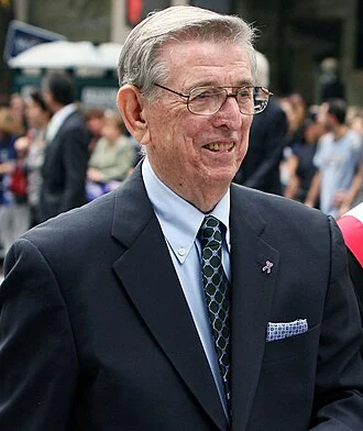 Lou Carnesecca height profile photo