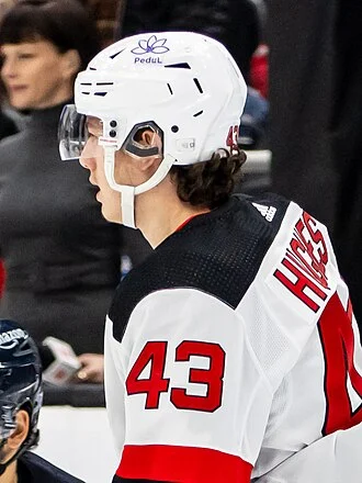 Luke Hughes (ice hockey) height profile photo