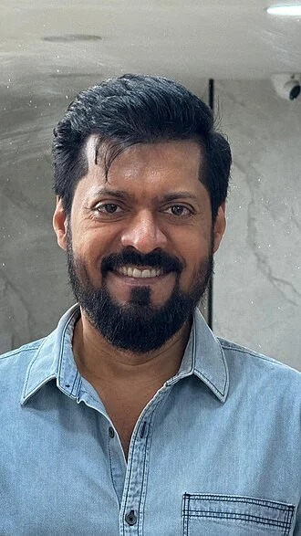 Magizh Thirumeni height profile photo