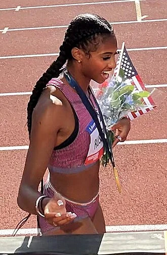 Masai Russell height profile photo