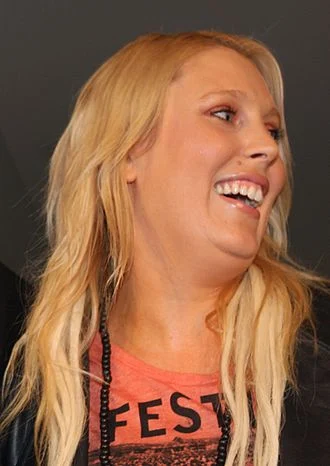 Mel Greig height profile photo