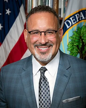 Miguel Cardona height profile photo