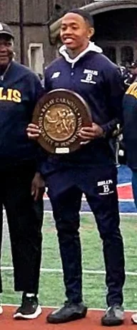 Quincy Wilson (runner) height profile photo