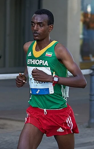 Tamirat Tola height profile photo