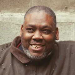 Azie Faison height profile photo