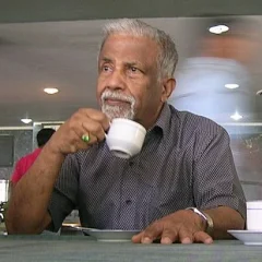 E. C. George Sudarshan height profile photo