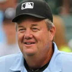 Joe West (umpire) height profile photo