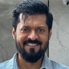Magizh Thirumeni height profile photo
